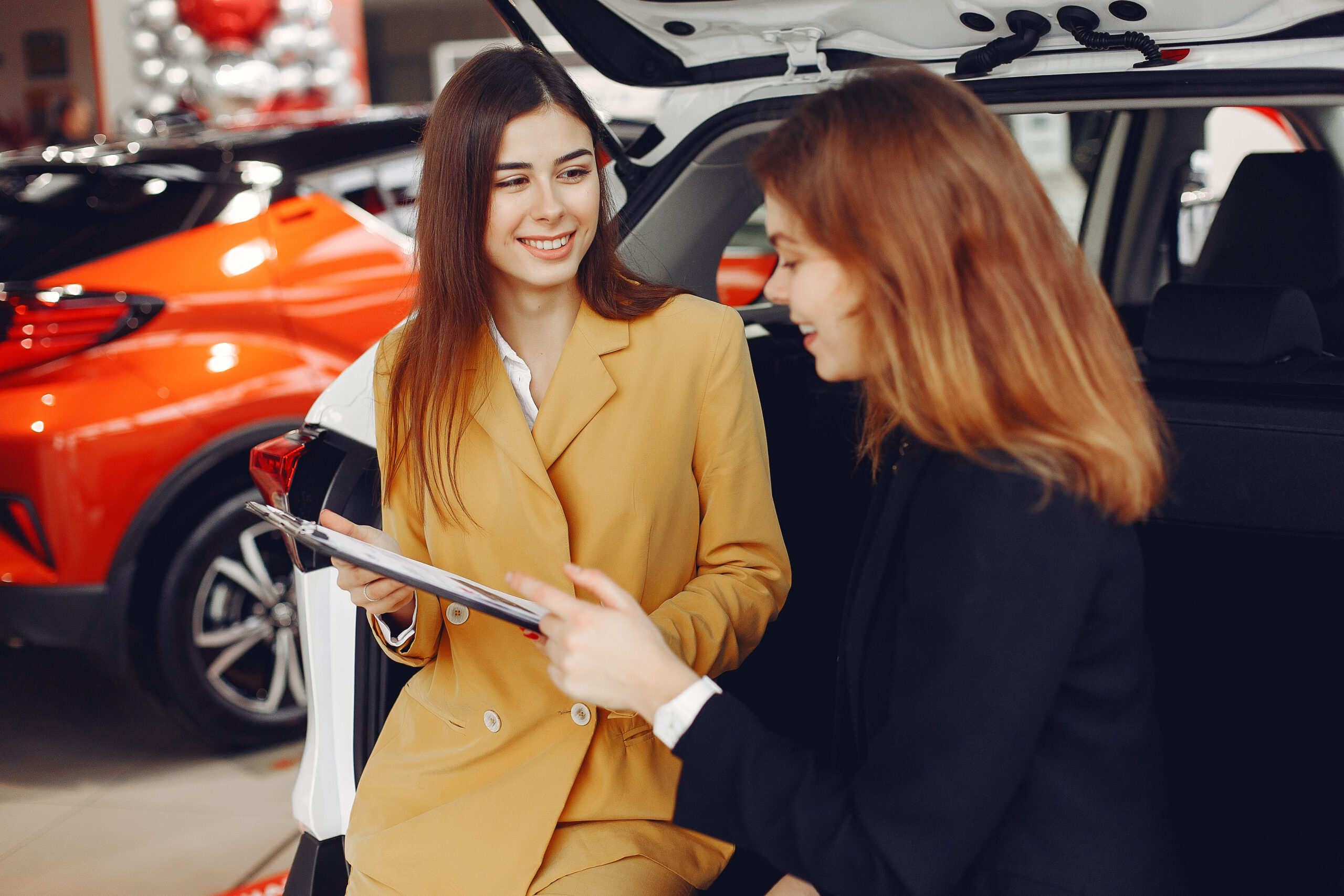 How do car dealerships attract more customers?