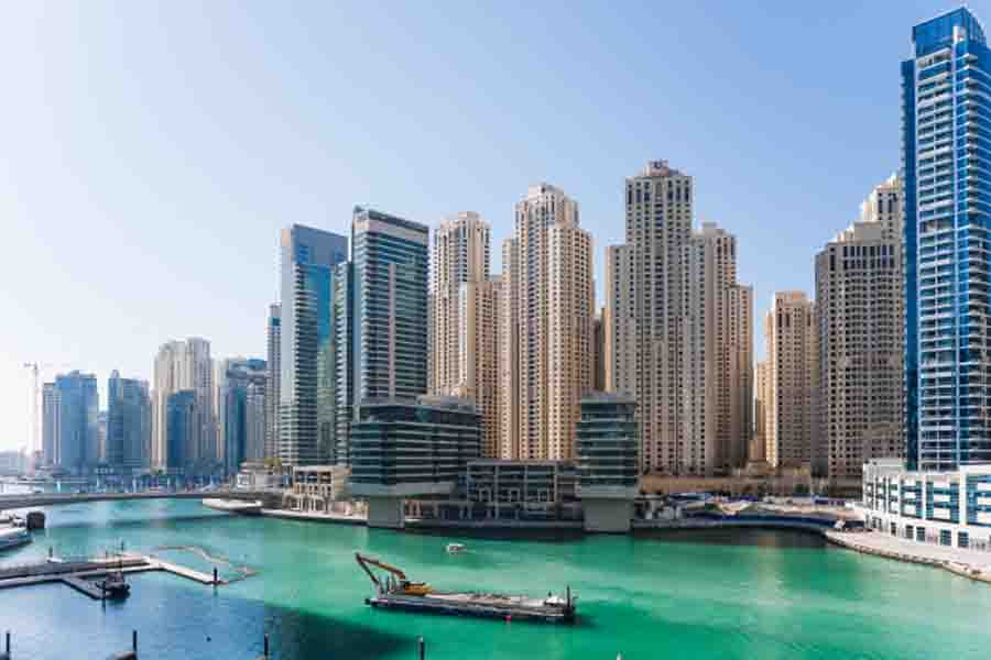 How should you save money on hotels in Dubai?